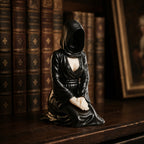 The Devoted kneeling faceless hooded figurine – gothic shelf decor matte black resin – lifestyle scene dark shelf – PrintableArtForge