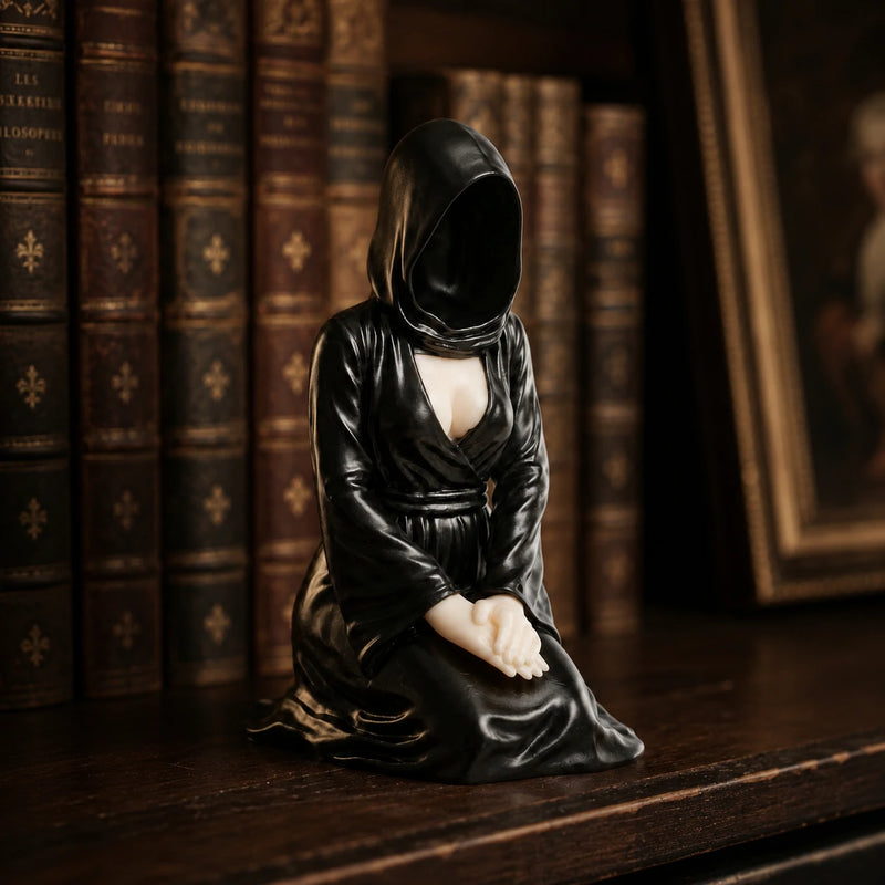 The Devoted kneeling faceless hooded figurine – gothic shelf decor matte black resin – lifestyle scene dark shelf – PrintableArtForge