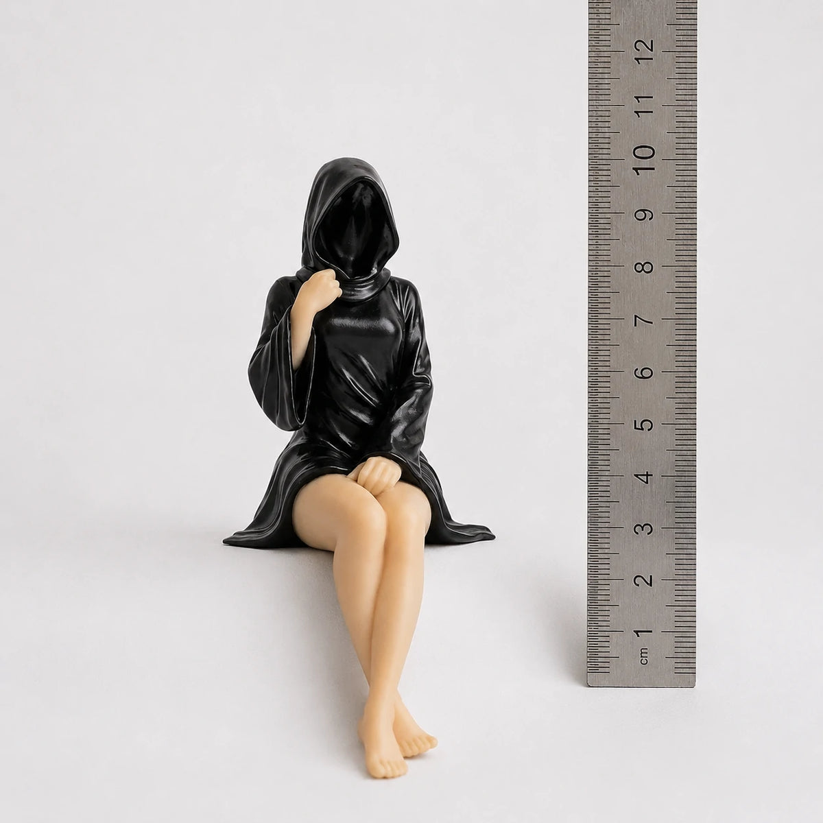 The Keeper sitting faceless hooded figurine – gothic shelf decor matte black resin – size comparison with ruler – PrintableArtForge
